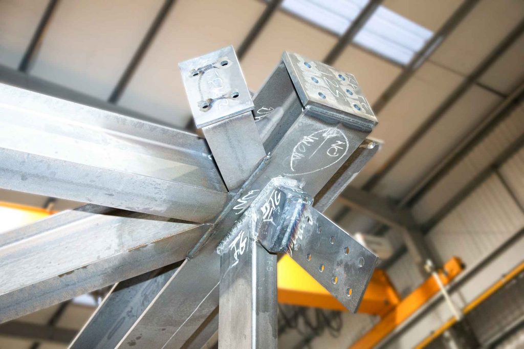 Steel Fabrication ( pre build) of Silverstone Circuit bridge- close up of welded node  image by James Thompson Construction photographer. 