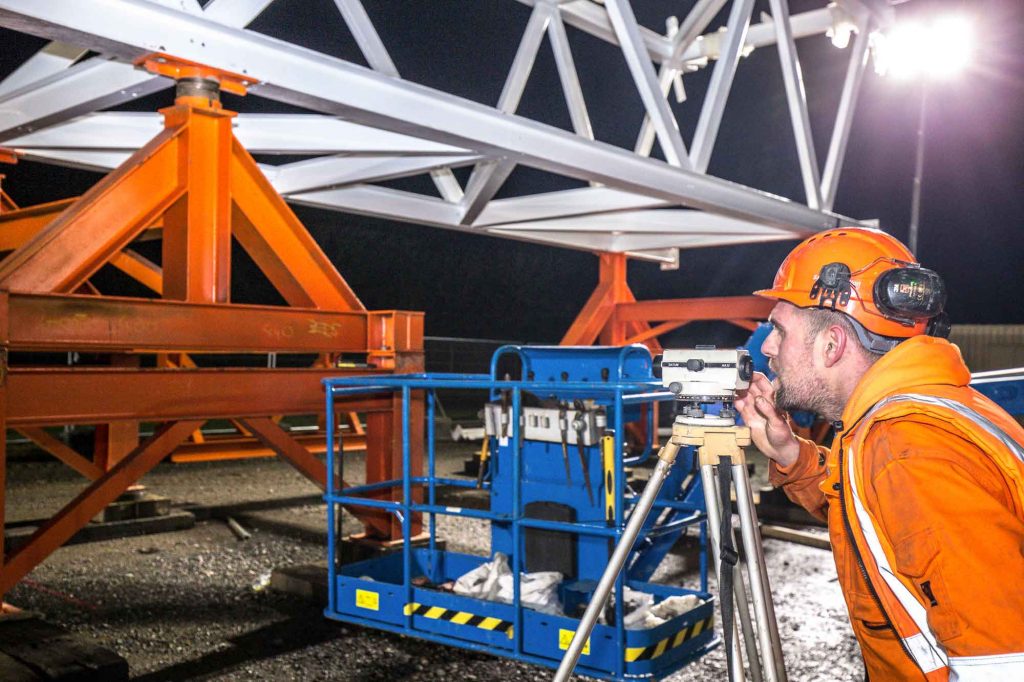 Silverstone Bridge- close up of levelling the bridge at night -  image by James Thompson Construction photographer.
