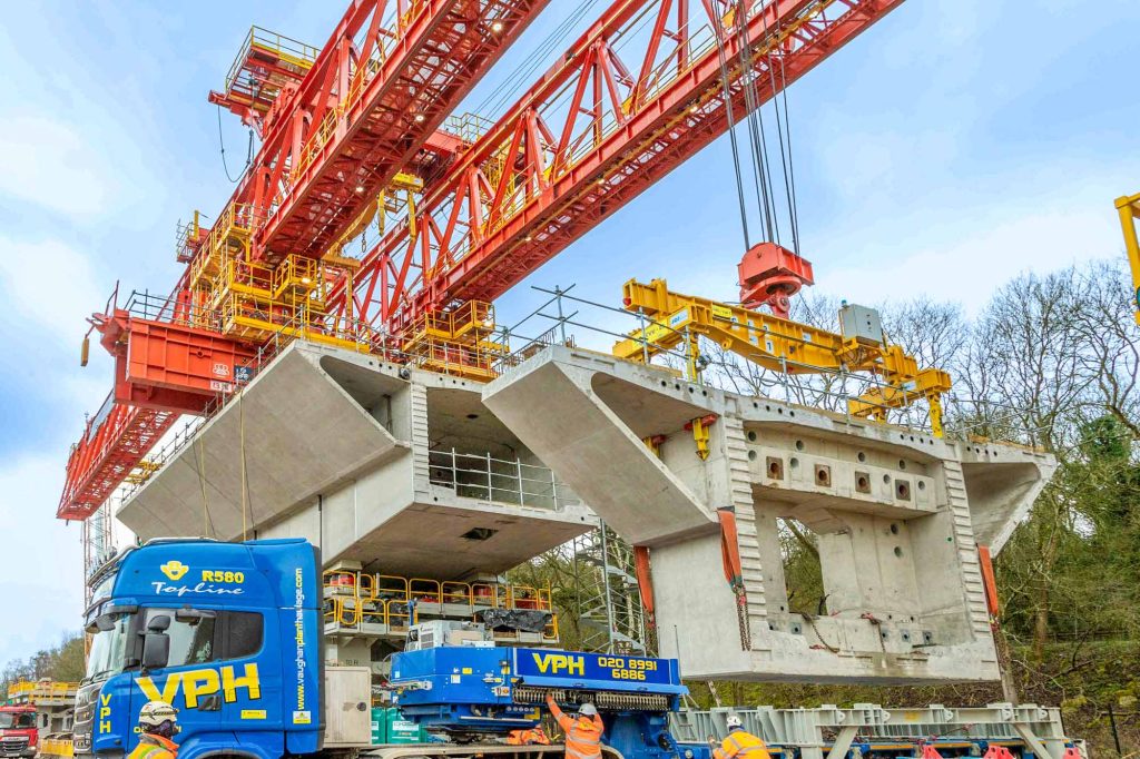 HS2 C1 package massive concrete viaduct support installation using red launching gantry and VPH heavy lift crane for high-speed rail infrastructure construction