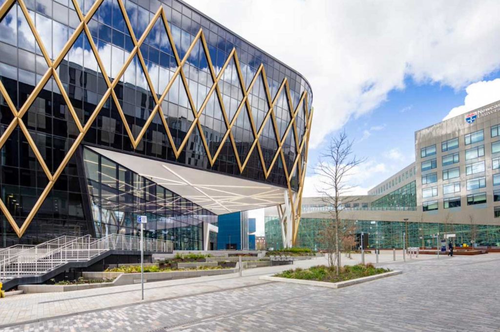 The Catalyst Newcastle completed building showing award-winning diagrid steel facade and glazing system with National Innovation Centre branding