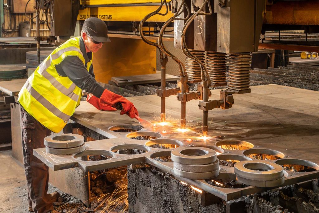 Volvo automotive metal fabrication industrial photography CNC cutting manufacturing