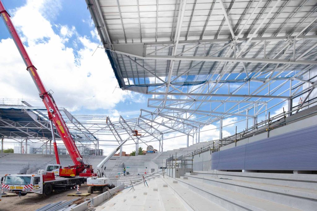 Brentford FC stadium construction London Premier League architecture steel framework photography