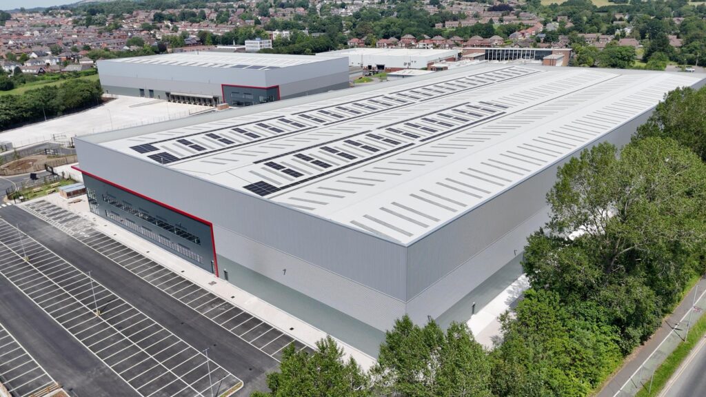 Aerial view of Arrow Point Bolton showing rooftop photovoltaic panels and both logistics units
