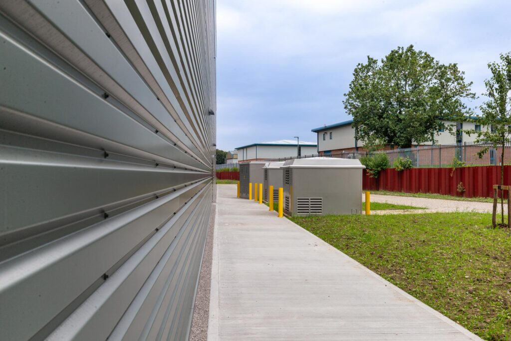 Close-up of profiled cladding and completed external works at Arrow Point Bolton